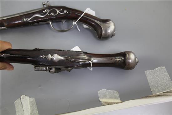 A pair of 20 bore Flemish flintlock holster pistols by C. Chaplot A. Adelshein, late 17th century, 12.75in. barrels, overall 20in.